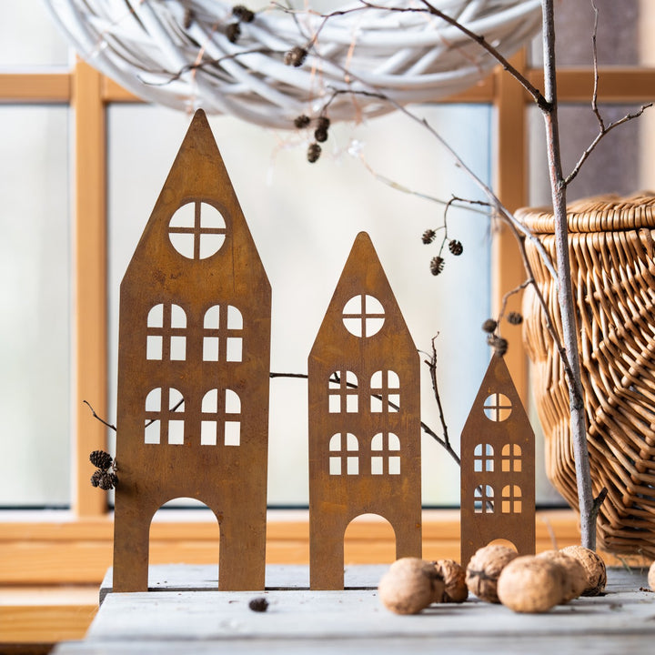 Rusty metal garden stakes (houses)