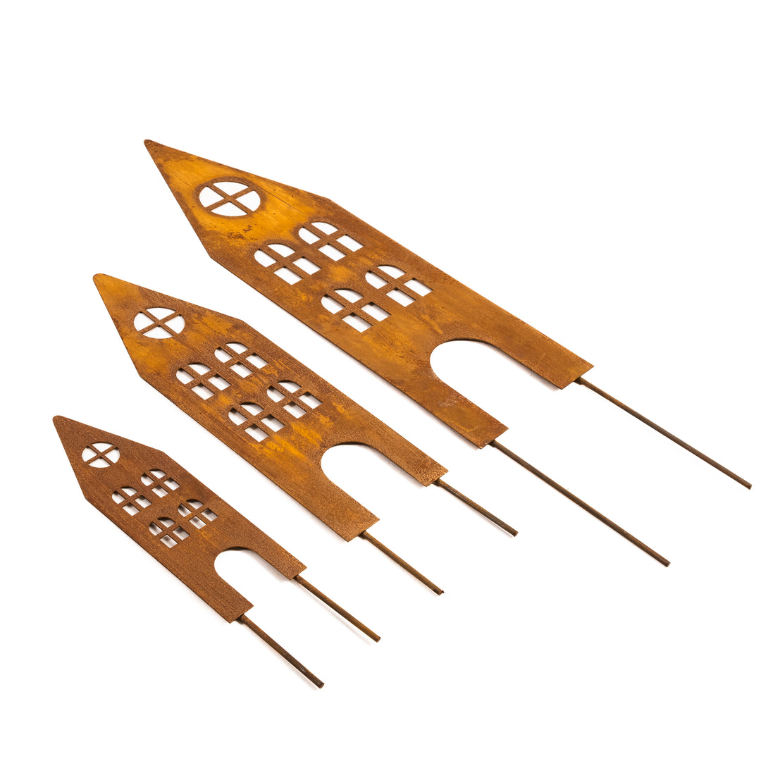 Rusty metal garden stakes (houses)