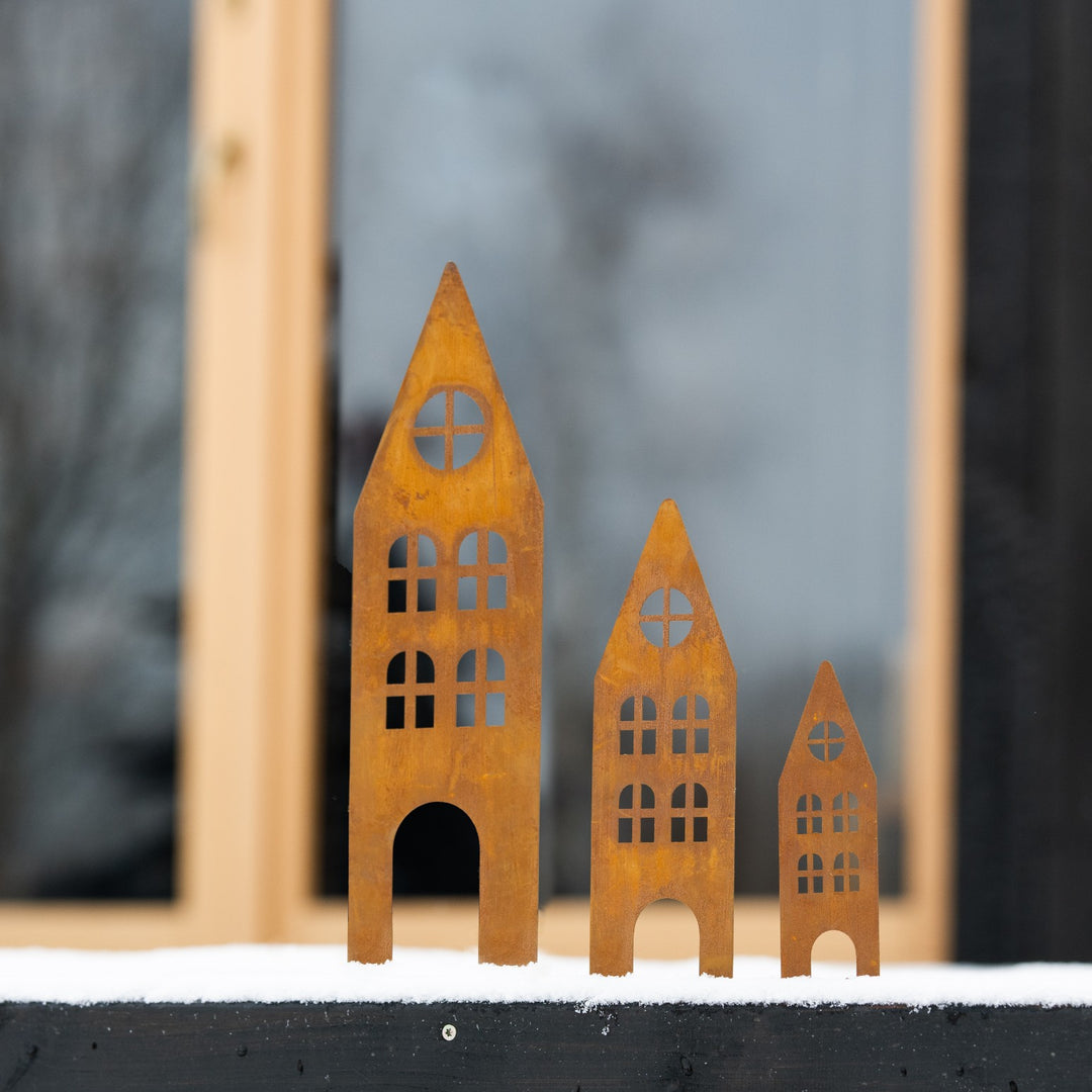 Rusty metal garden stakes (houses)